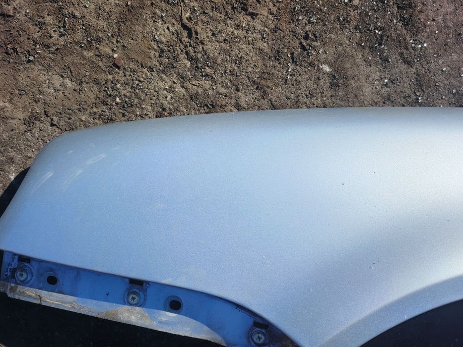 Volkswagen Golf 4 IV błotnik lewy srebny LA7W