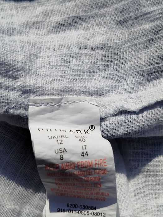 Biała spódnica na guziki z nieregularnym dołem Primark 40 L