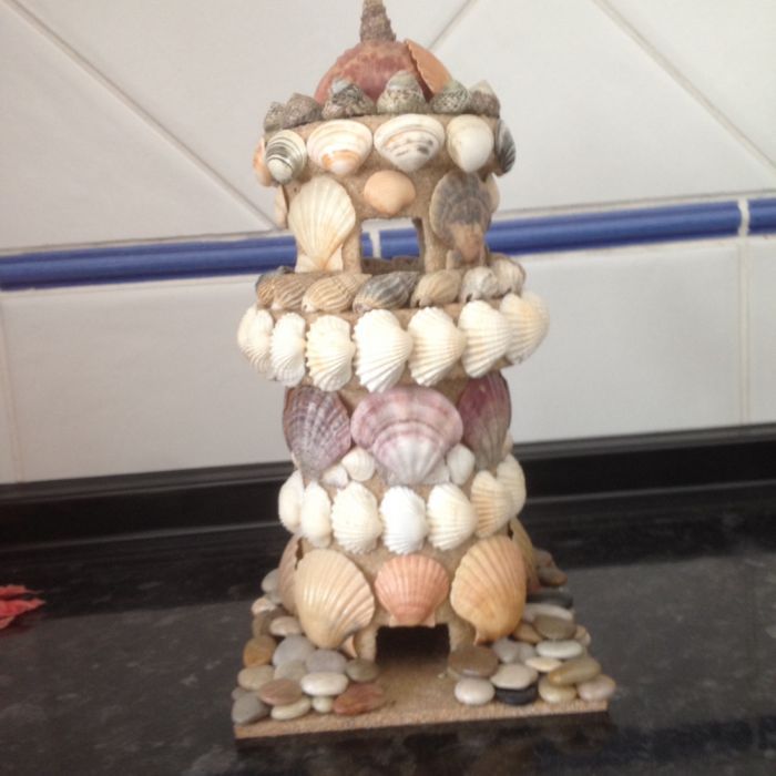 castelo feito com conchas tudo feito à mão