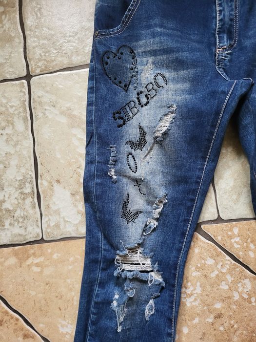 Spodnie dżinsowe L z ozdobnymi mankietami