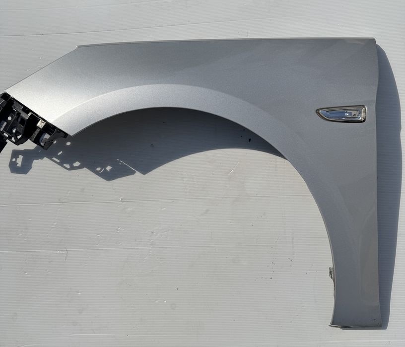 Opel Astra k blotnik lewy z176