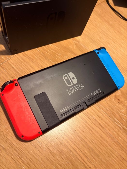 Nintendo Switch Azul/Vermelho + Bolsa Animal Crossing + Grip Joy-Con + Fatura