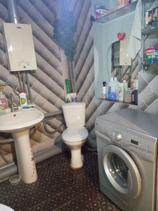 Продам часину будинка в центрі Зміїва