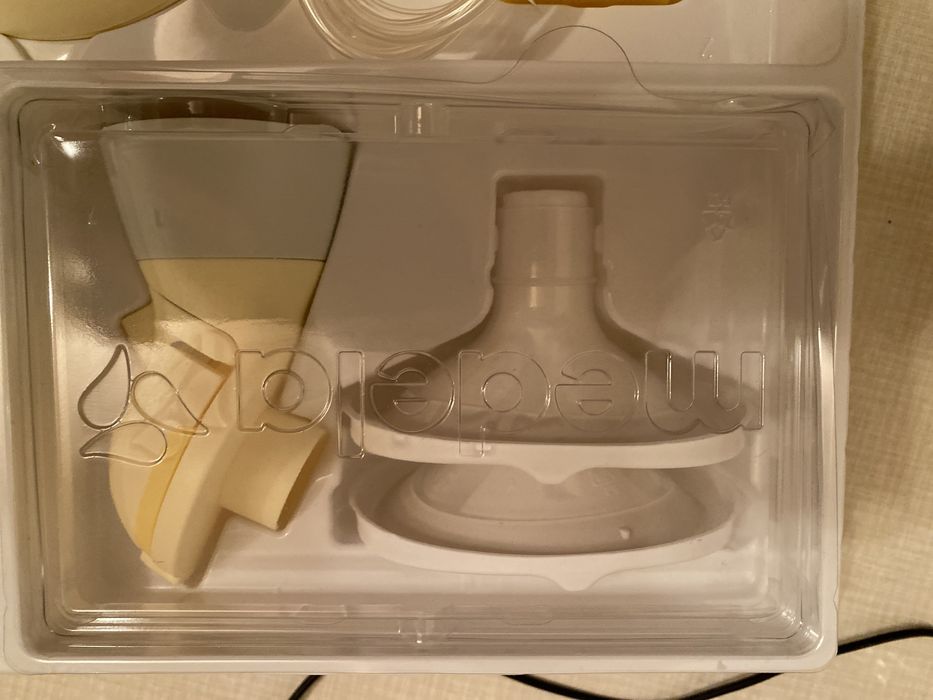 Електронный молокоотсос medela