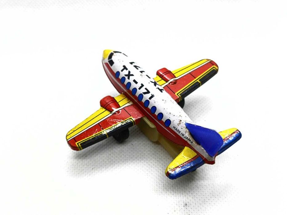 Avião brinquedo antigo em lata de fricção TX 171