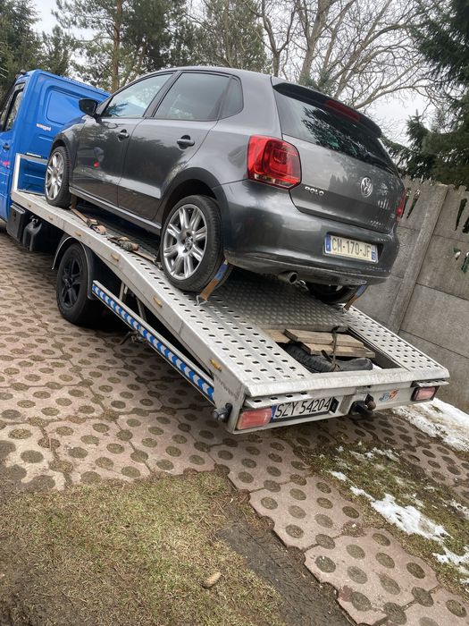 Laweta transport samochodow łodzi przyczep pomoc drogowa