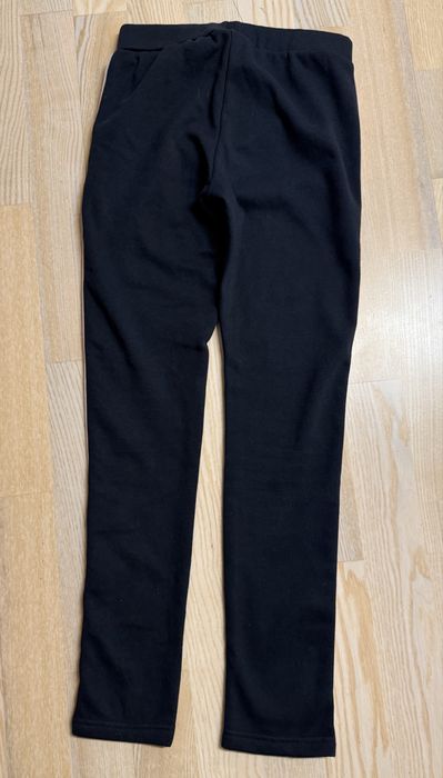 Ciepłe dziewczęce spodnie na polarze legginsy rozm 158