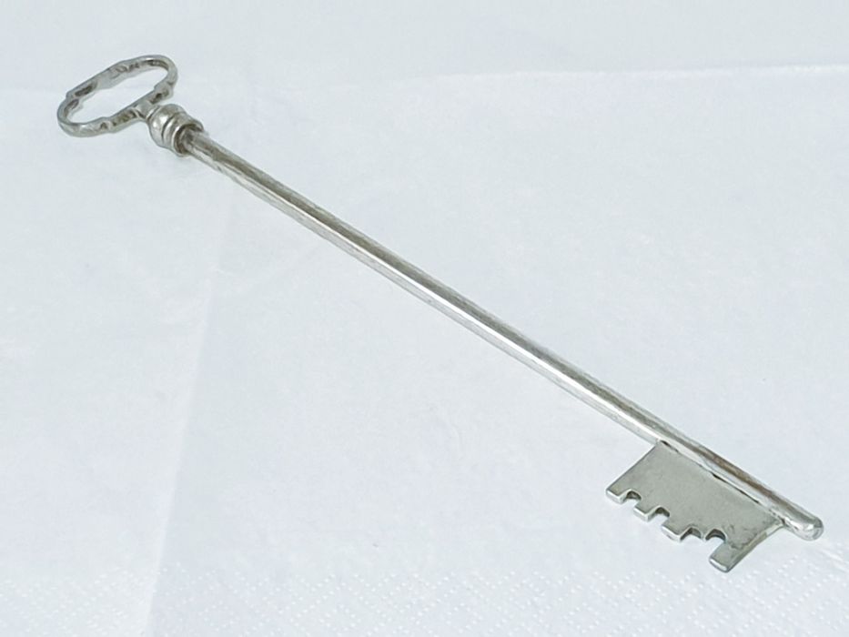Large antique key with silver plating