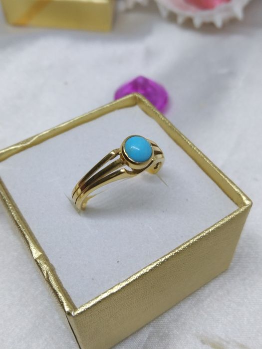 Piękny złoty pierścionek niebieskie oczko, złoto 333, r. 14