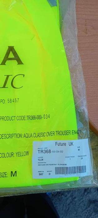 Calças e colete amarelo de trabalho impermeáveis