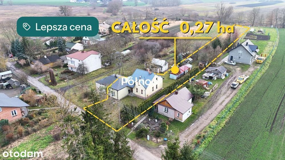 Dom przy spokojnej ulicy, nad rzeką.