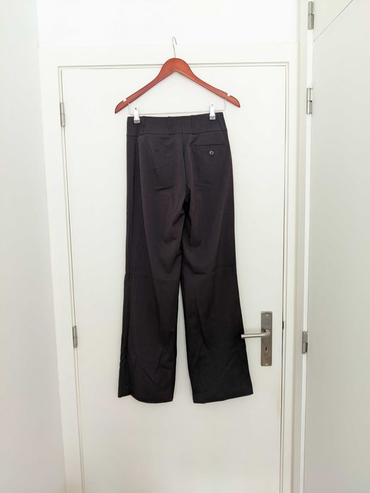 Calças H&M pretas boca de sino