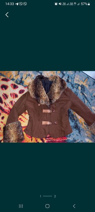 Продам фирменную куртку Motivi на девочку