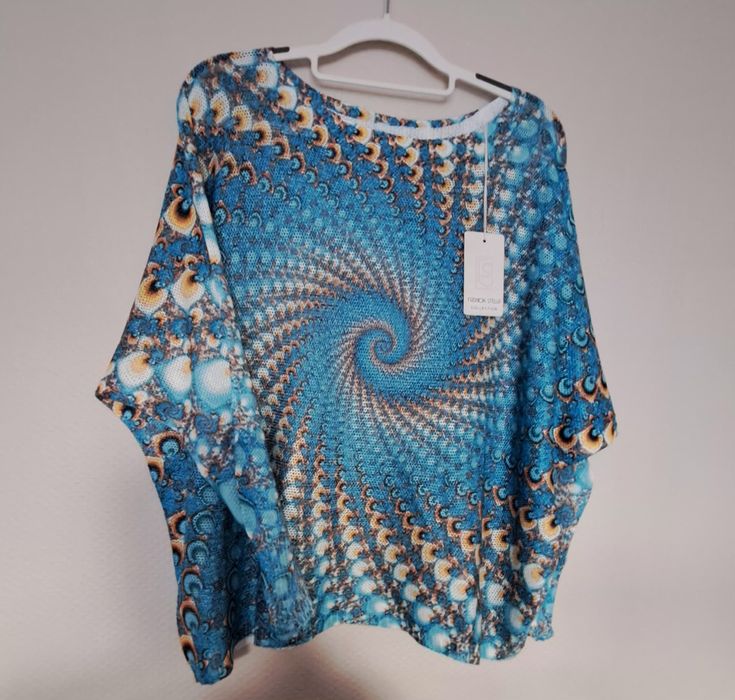 Sweterek niciak turkusowy