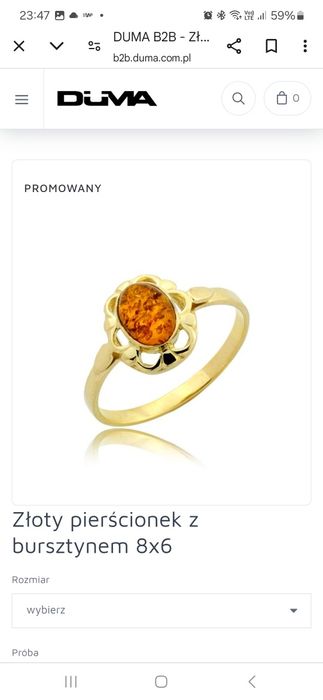 Złoty pierścionek 585 z bursztynem w ażurowej oprawie r 16