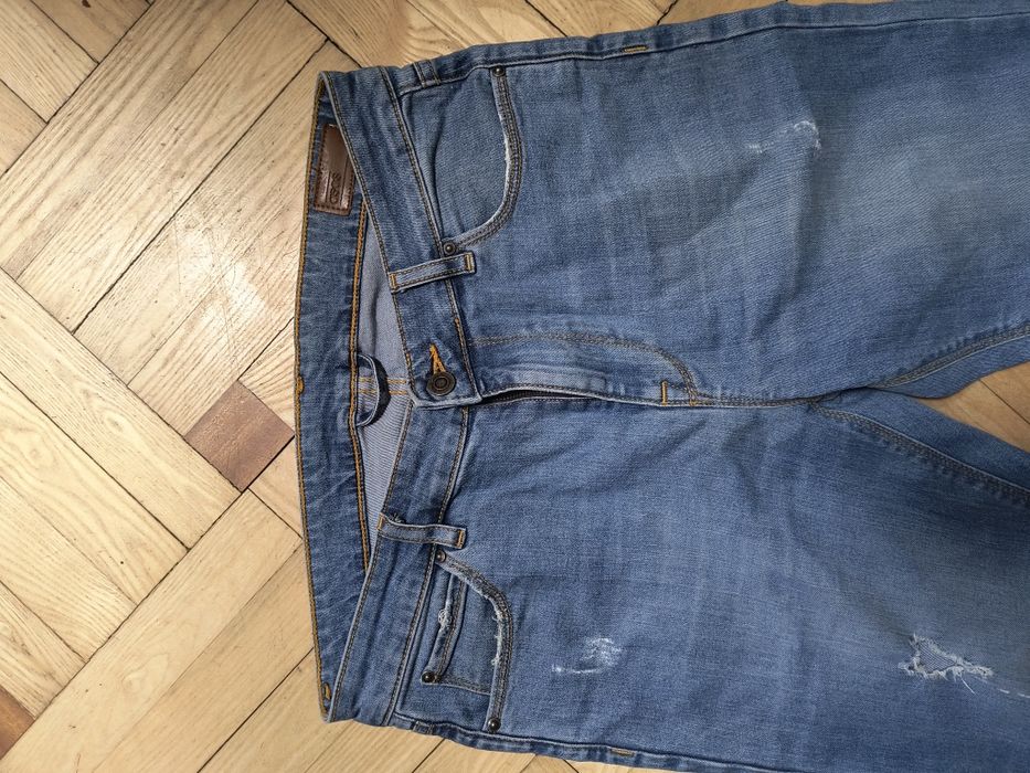 Jeansy męskie ASOS z dziurami W32 L30
