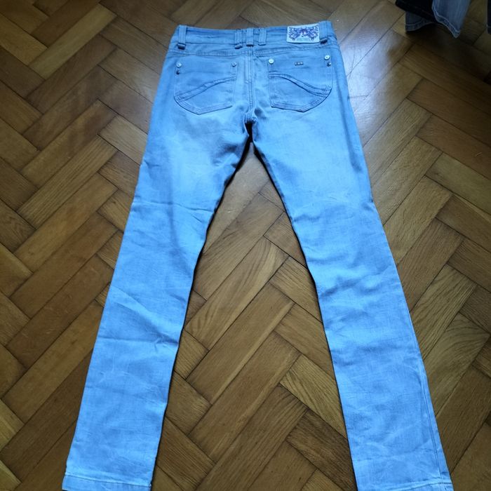 DIESEL spodnie damskie jeansy slim 
DIESEL Roxanne