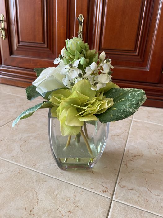 Decorative item with green-toned flowers