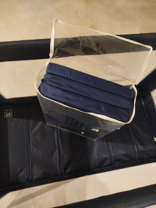 Cama de viagem e colchão