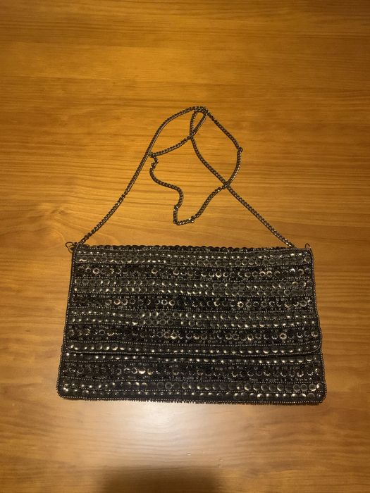 Black crossbody bag with metal motifs