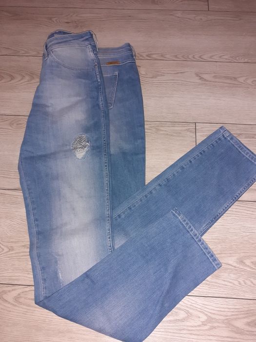 Spodnie Wrangler z przetarciami 28/32