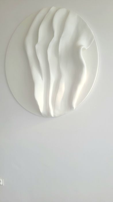 Okrągła płaskorzeźba - rzeźba ścienna