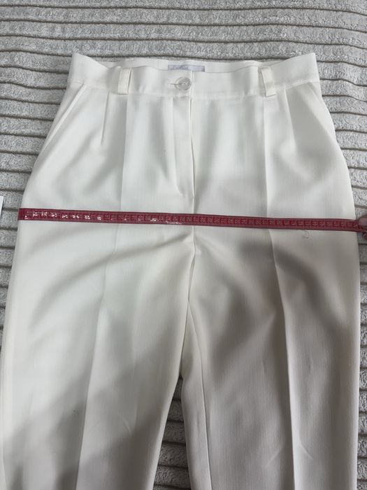 Елегантний жіночий костюм молочного кольору (піджак + штани)