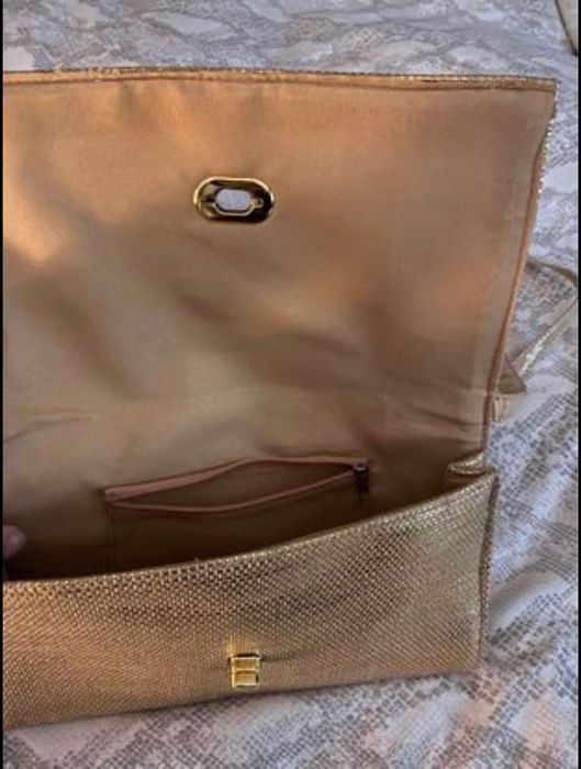 Clutch dourada nova