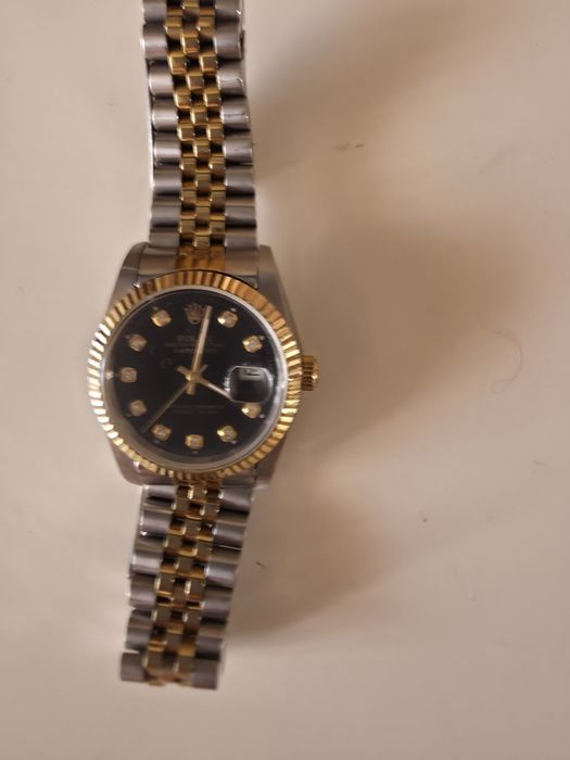 Часы Rolex в идеальном состоянии.