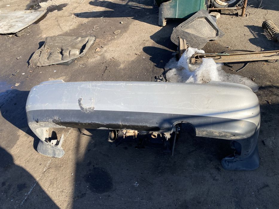 Бампер задний mazda 323ba седан