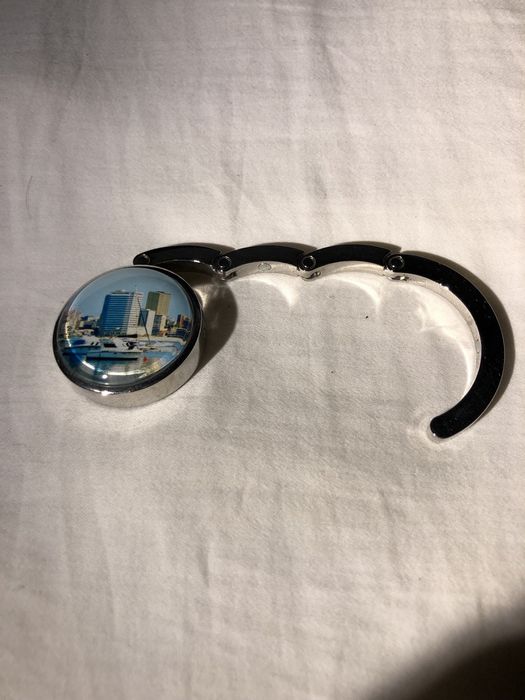 Peça para pendurar carteiras