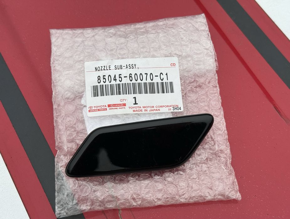 Заглушка форсунки омивача фар Toyota Prado 150.  85045-60070-C1