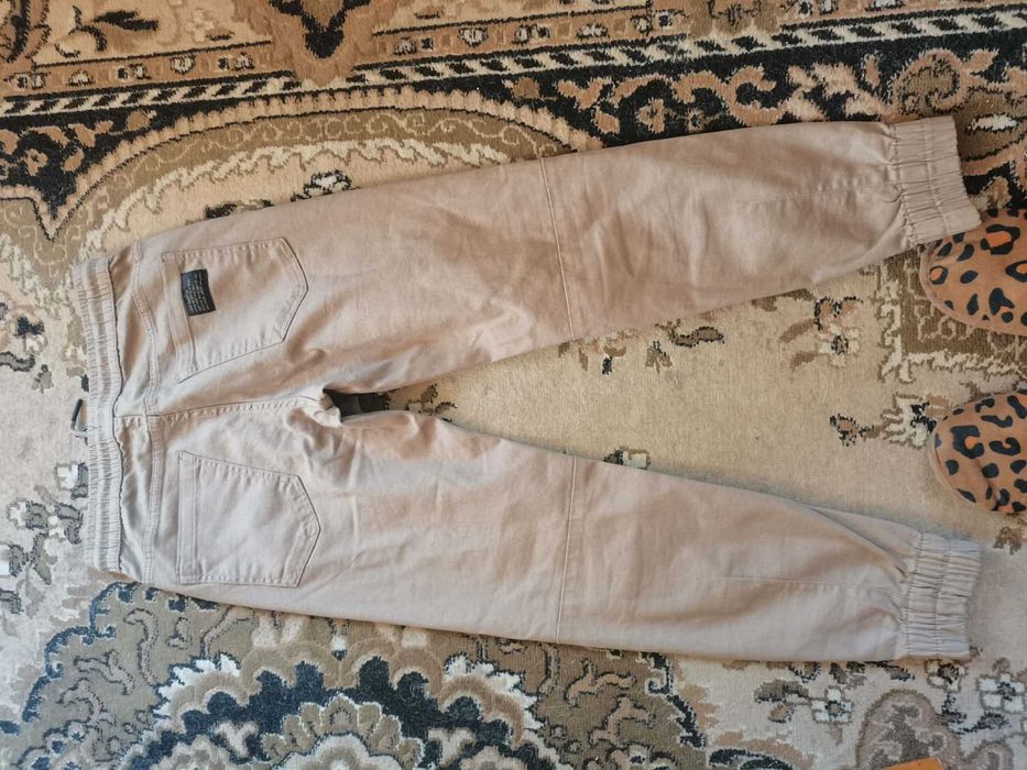 Spodnie Cropp 28