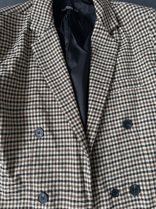 Жіночий піджак в клітинку