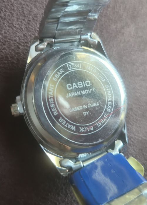Relógio Casio MTP-1302 - cinza e branco