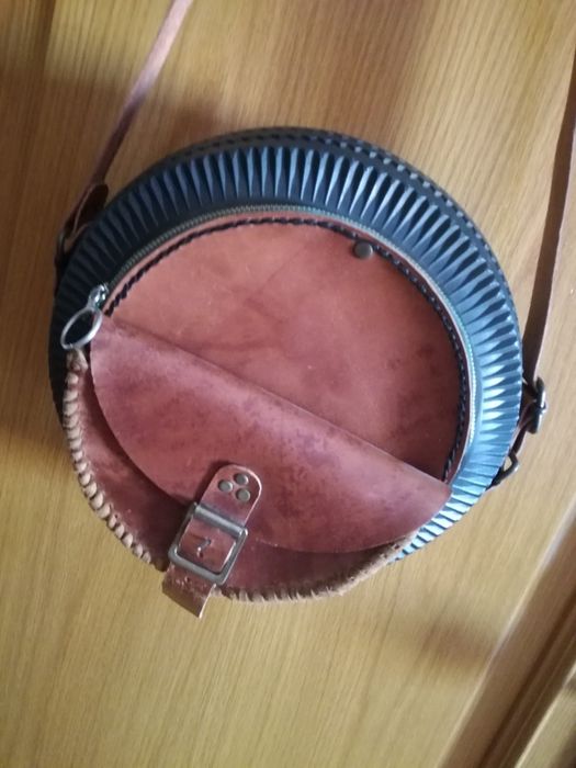 Mala em pele e borracha Novo