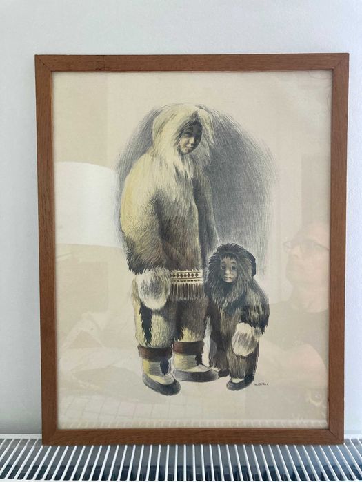 Dwaj Eskimosi w ramie i za szybą