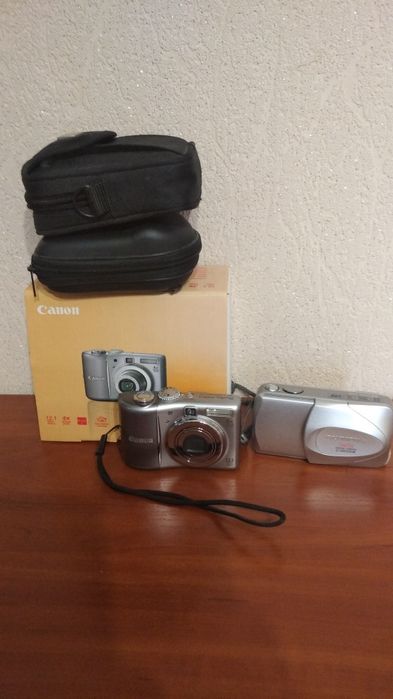 Цифровые фотоаппараты Canon A 1100. IS , Olympus.