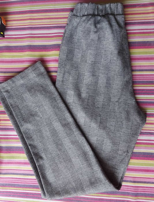 Reserved Spodnie dziewczęce w czarno-białą w kratę 164