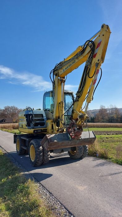Wynajem koparki kołowej NEW HOLLAND MH 2.6 wypożyczenie koparki 10Ton