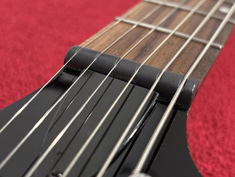 Cort X2, progi ze stali nierdzewnej, siodełko TUSQ, struny ELIXIR