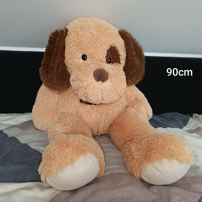 Pluszak maskotka pies z brązową kokardką