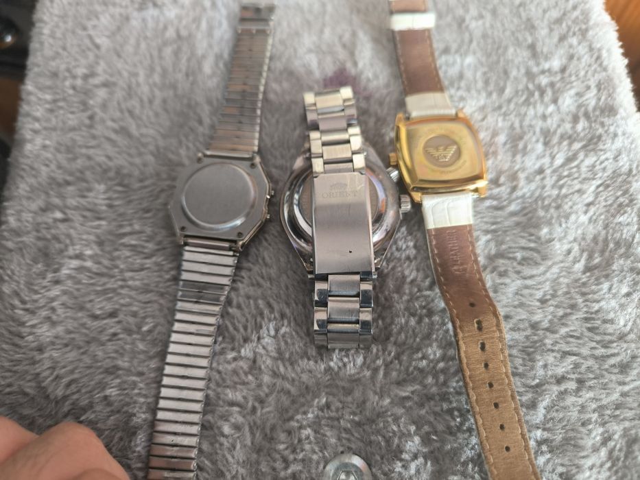 3 zegarki orient Armani i jakis elektroniczny