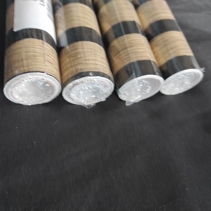 Quatro rolos de papel autocolante