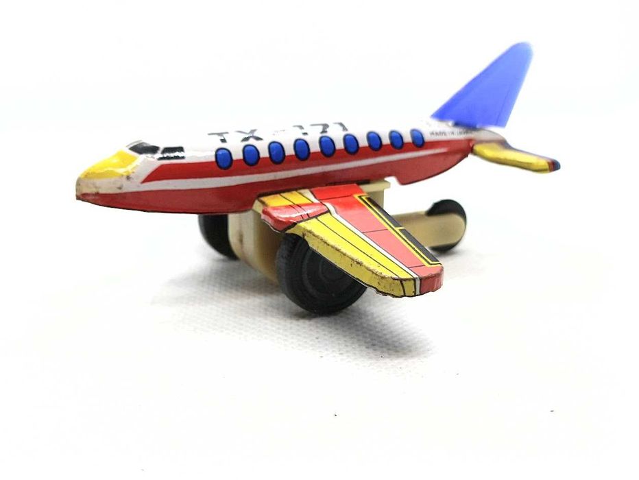 Avião brinquedo antigo em lata de fricção TX 171