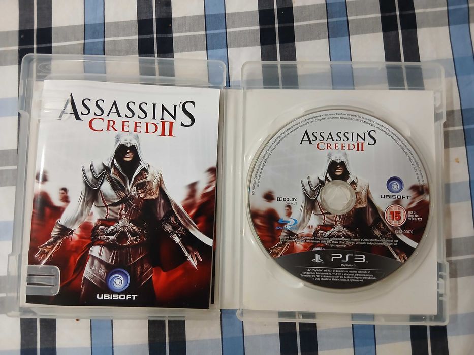 Playstation 3 usada com alguns bons jogos.