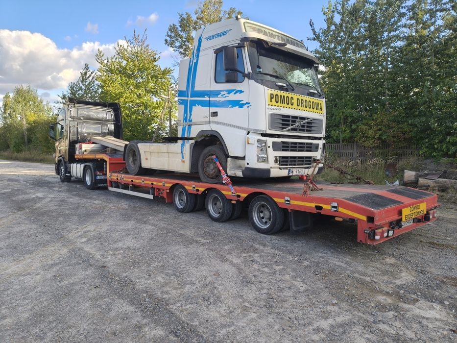 Transport maszyn ciągników holowanie pomoc drogowa  laweta