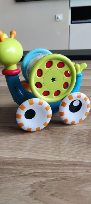 Muzyczny Ślimak Yookidoo  interaktywna Zabawka dla niemowląt 2w1 do raczkowania i układania piramidki