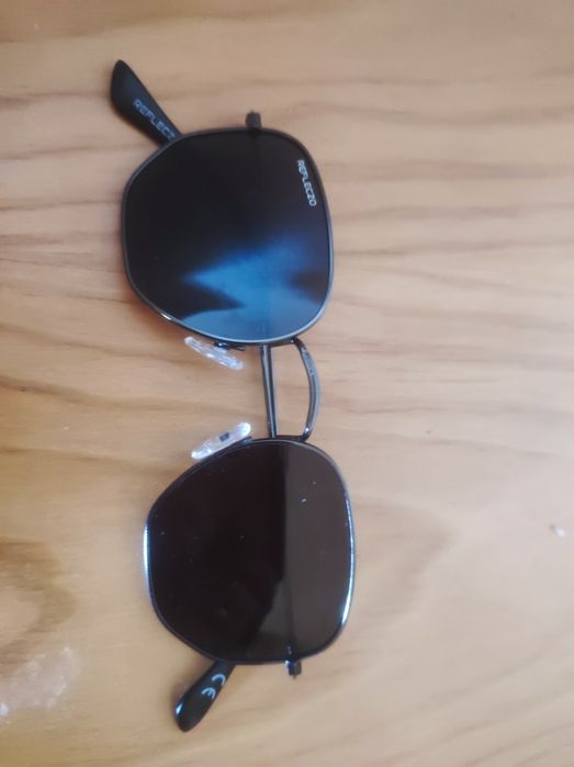 Óculos sol marca reflexo