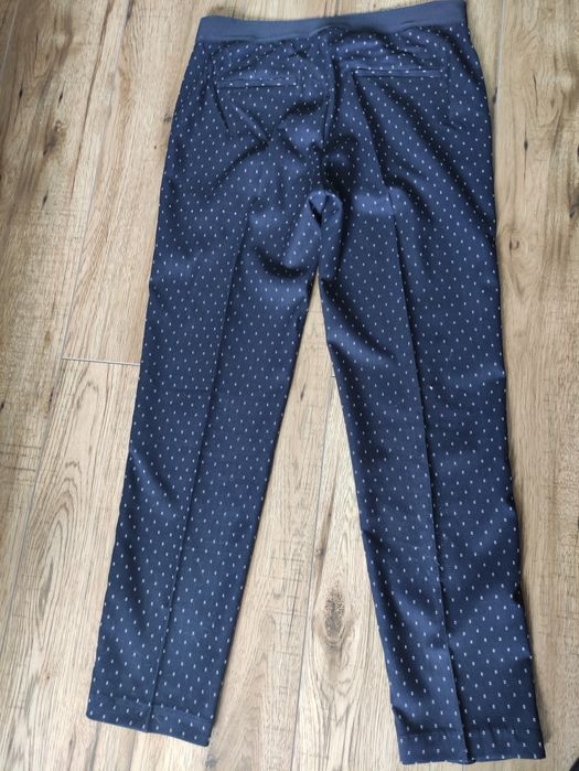 Eleganckie  granatowe w białe paseczki  spodnie damskie rozm. 40/42
